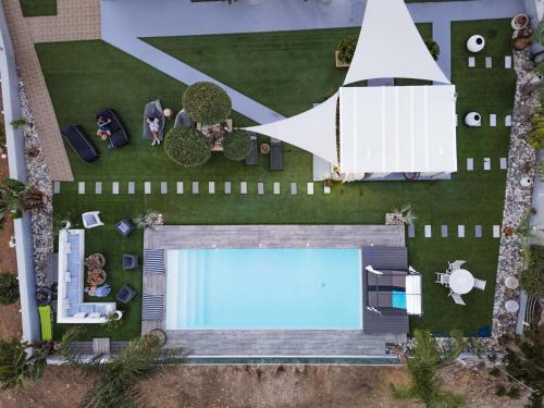 an overhead view of a swimming pool and a building at Kasparis View Residence in Pano Lefkara