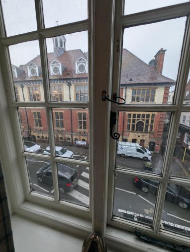 an open window with a view of a street at The Bear Marlborough in Marlborough