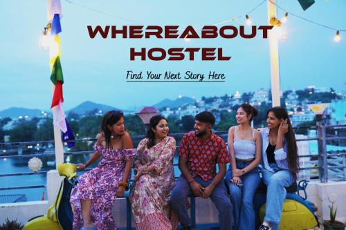 a poster of a group of people sitting on a boat at Whereabout Hostel Udaipur in Udaipur