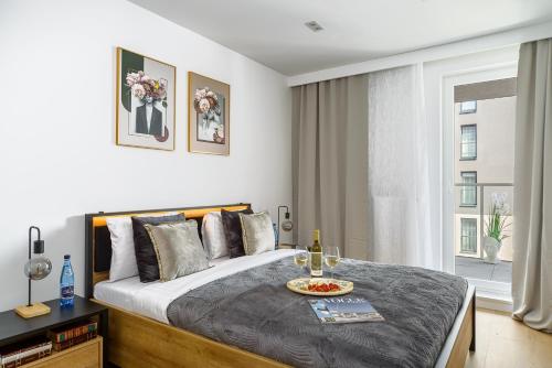 Posteľ alebo postele v izbe v ubytovaní Lumina lux apartment on Drewnowska