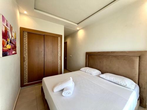 Postel nebo postele na pokoji v ubytování Seaside Apartments