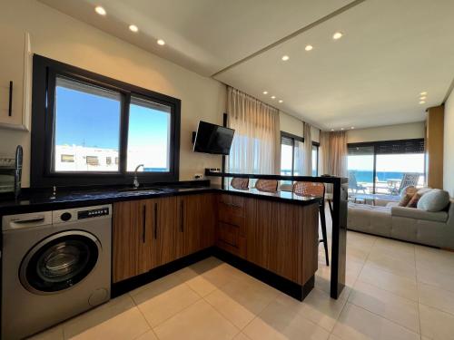 Kuchyň nebo kuchyňský kout v ubytování Seaside Apartments