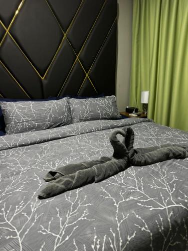 Ένα ή περισσότερα κρεβάτια σε δωμάτιο στο Pavema Apartments