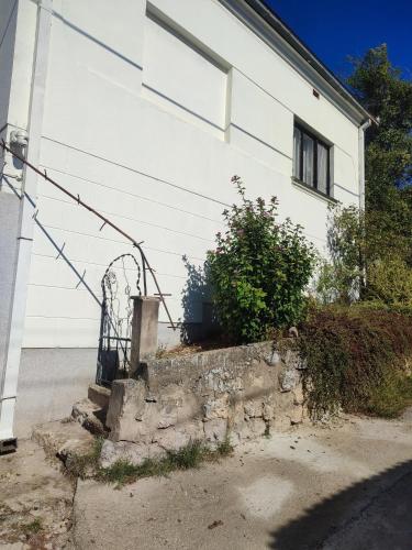 a white house with a gate in front of it at Vila Ružica in Sićevo