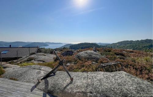 a metal object on top of some rocks at 3 Bedroom Gorgeous Home In Lyngdal in Lyngdal