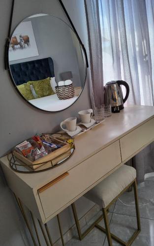 Kemudahan buat kopi dan teh di AFRICAN DREAM LODGE MBAZWANA