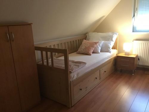 Postel nebo postele na pokoji v ubytování Kert Apartman