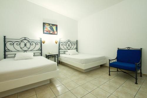 Postel nebo postele na pokoji v ubytování Hotel Bedd Express Querétaro