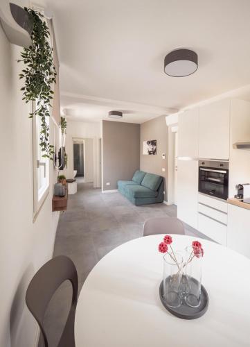 a living room with a white table and chairs at Domus Varazze in Varazze