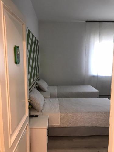 Postel nebo postele na pokoji v ubytování B&B Homer Trento