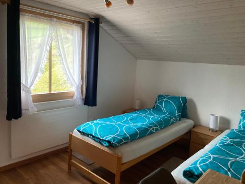 Postel nebo postele na pokoji v ubytování Haus Dorfblick