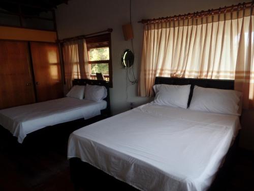 Postel nebo postele na pokoji v ubytování Finca con jacuzzi a 15min de Guatape