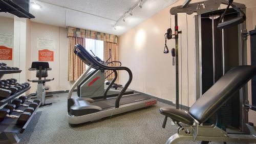 a gym with a treadmill and some tread machines at Best Western Fort Myers Inn and Suites in Fort Myers