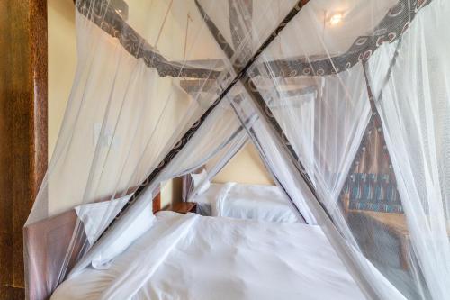 Cama ou camas em um quarto em Mahi Mahi Beach Hotel