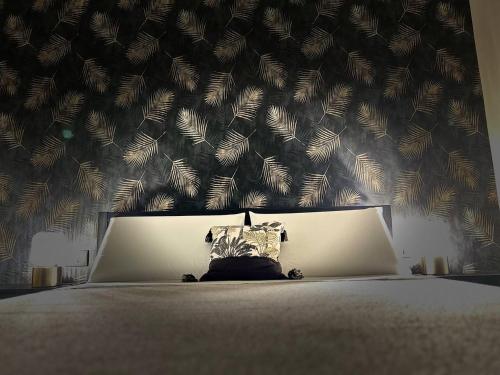 a dog laying on a bed with a pillow at Favola Guesthouse Affittacamere in Nettuno