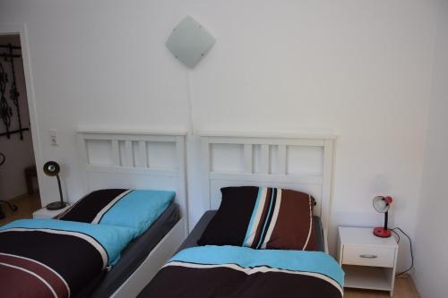 Postel nebo postele na pokoji v ubytování Bergmühle Simmertal