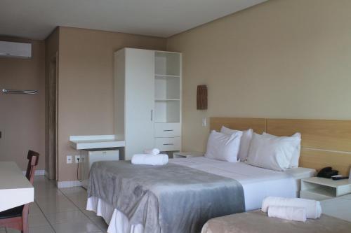 Ένα ή περισσότερα κρεβάτια σε δωμάτιο στο Hotel Brisa da Costa
