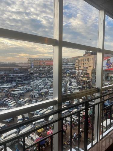 a view from a window of a parking lot at Royal Hotel Apartments in Kampala