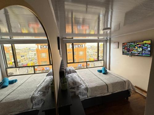 Postel nebo postele na pokoji v ubytování Gato Neon Hostel
