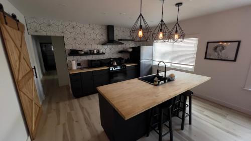 a kitchen with a island in the middle of a room at 2BR Lit and Spacious in the Heart of Hollywood in Los Angeles