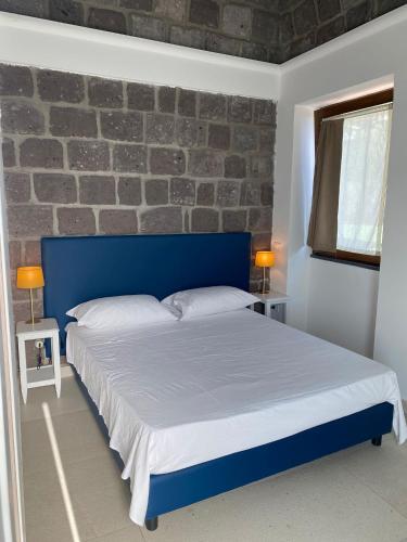 Postel nebo postele na pokoji v ubytování Torre delle Grazie Sorrento Suite