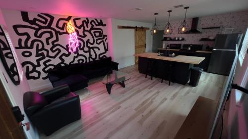 a living room with a couch and a table at 2BR Lit and Spacious in the Heart of Hollywood in Los Angeles