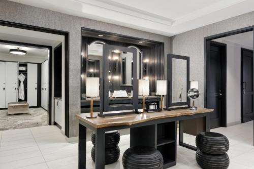 a dressing room with a vanity and mirrors at Four Seasons Resort Vail in Vail