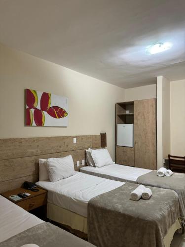 Ένα ή περισσότερα κρεβάτια σε δωμάτιο στο Hotel Brisa da Costa