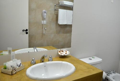 a bathroom with a sink and a mirror at Posada de los Poetas Hotel Boutique in San Lorenzo