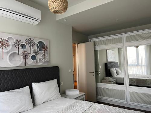 a bedroom with a bed with plates on the wall at huzurlu ve şirin in Istanbul
