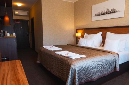 Postel nebo postele na pokoji v ubytování PREMIUM Business Hotel Bratislava