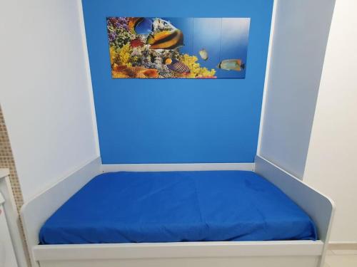 Postel nebo postele na pokoji v ubytování Alloggio Azzurro a pochi passi dal mare