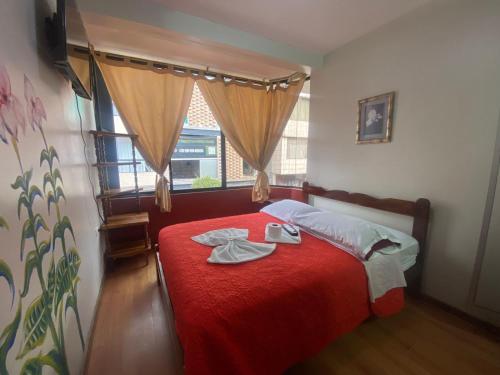 Postel nebo postele na pokoji v ubytování Andes Hostal