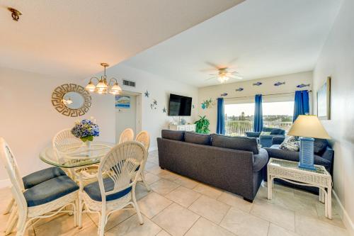 a living room with a couch and a table at Oceanfront Redington Shores Retreat Beach Access! in Clearwater Beach
