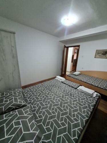 Postel nebo postele na pokoji v ubytování DM Guest House