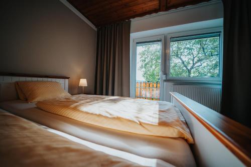 Postel nebo postele na pokoji v ubytování Hotel Leo