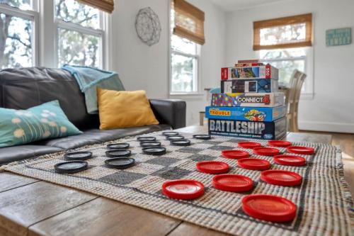 a chess game on a table in a living room at Retro by the Bay Close to Beach Eglin PetFriendly in Freeport