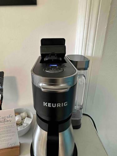 a coffee maker sitting on top of a counter at Retro by the Bay Close to Beach Eglin PetFriendly in Freeport