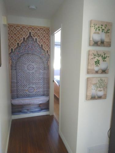 a hallway with a wall with a fire place at Beautiful Guest Home Riverfront Retreat 15 Min to Ottawa in Gatineau