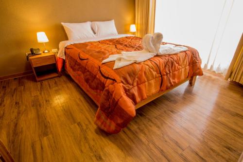 Krevet ili kreveti u jedinici u objektu Hotel Suiza Peruana