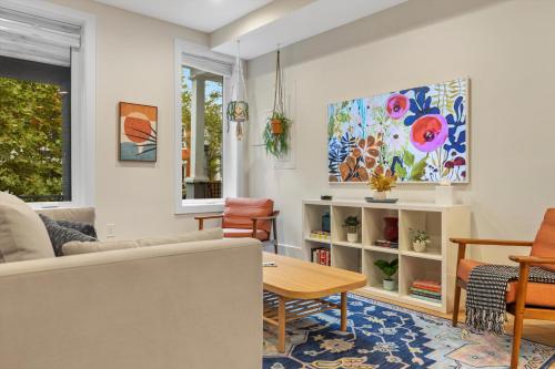 a living room with a couch and a table at Central DC 5-BR Townhome - Walk to METRO-rail in Washington, D.C.