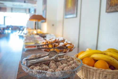 a buffet line with baskets of fruits and nuts at Hotel Montana SPA in Kruševo