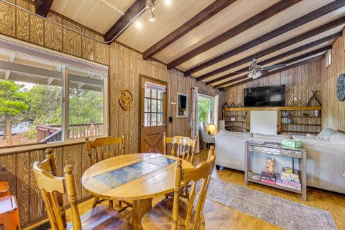 a living room with a table and a couch at 2 Mi to Dtwn Home with Deck and Grill in Payson in Payson
