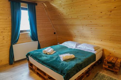 Postel nebo postele na pokoji v ubytování Rest point cottage Kazbegi