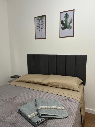Кровать или кровати в номере Apartamento inteiro aconchegante