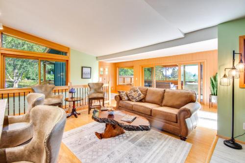 a living room with a couch and a table at Washington Gem on 8 5 Acres Clamming Nearby! in Port Ludlow