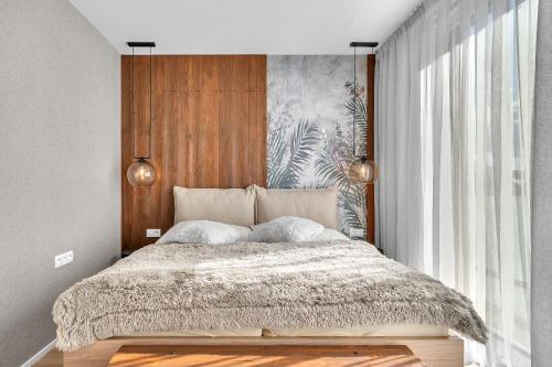 Ένα ή περισσότερα κρεβάτια σε δωμάτιο στο Apartment Viva Vrchlabí A41