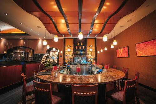 a bar with a round table in a restaurant at Agua Caliente Casino Rancho Mirage in Rancho Mirage