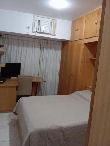 Postel nebo postele na pokoji v ubytování Residencial com Serviço