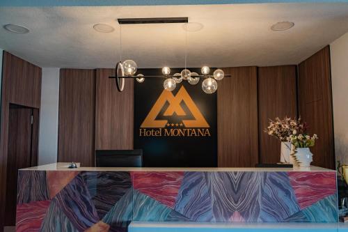 a sign on the wall of a hotel in a room at Hotel Montana SPA in Kruševo